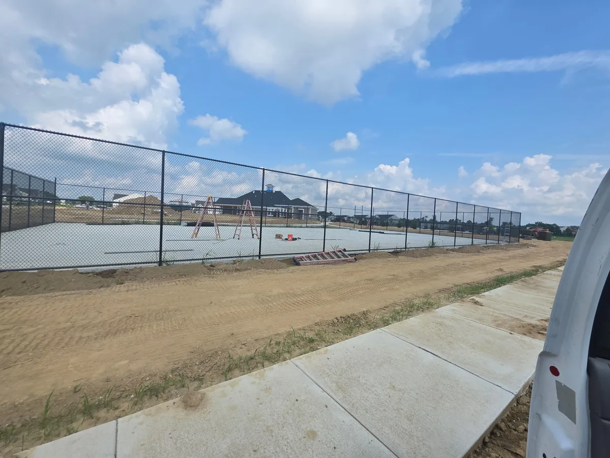 Black vinyl-coated chain link fence commercial installation