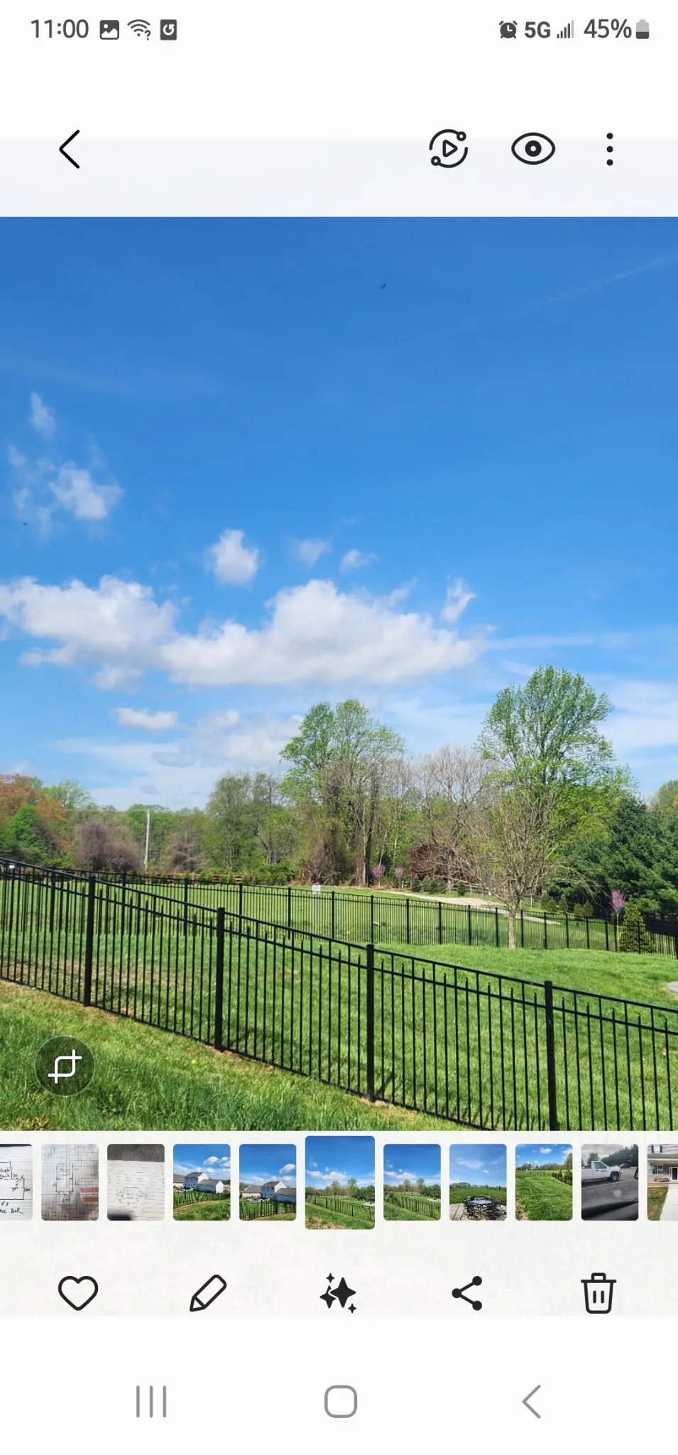 Black aluminum ornamental fence on beautifully landscaped property